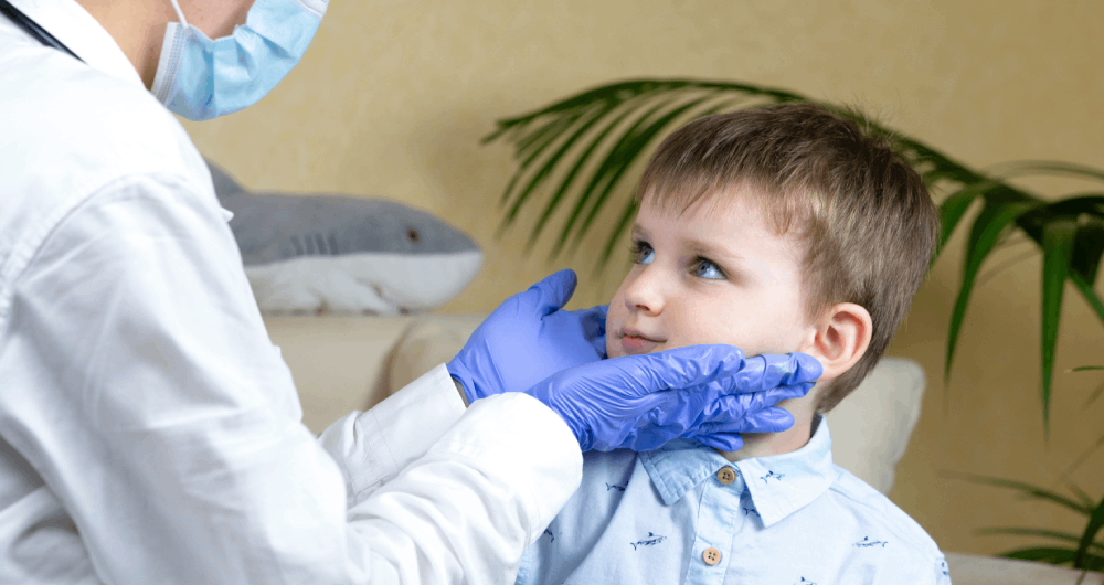 A doctor checking a childs throat